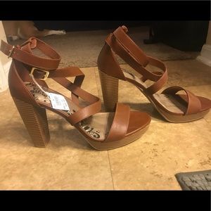 NWT! Size 11, 5in strapping heel. Brown